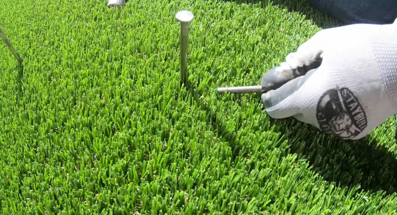 Secure artificial turf installation with professional nailing technique