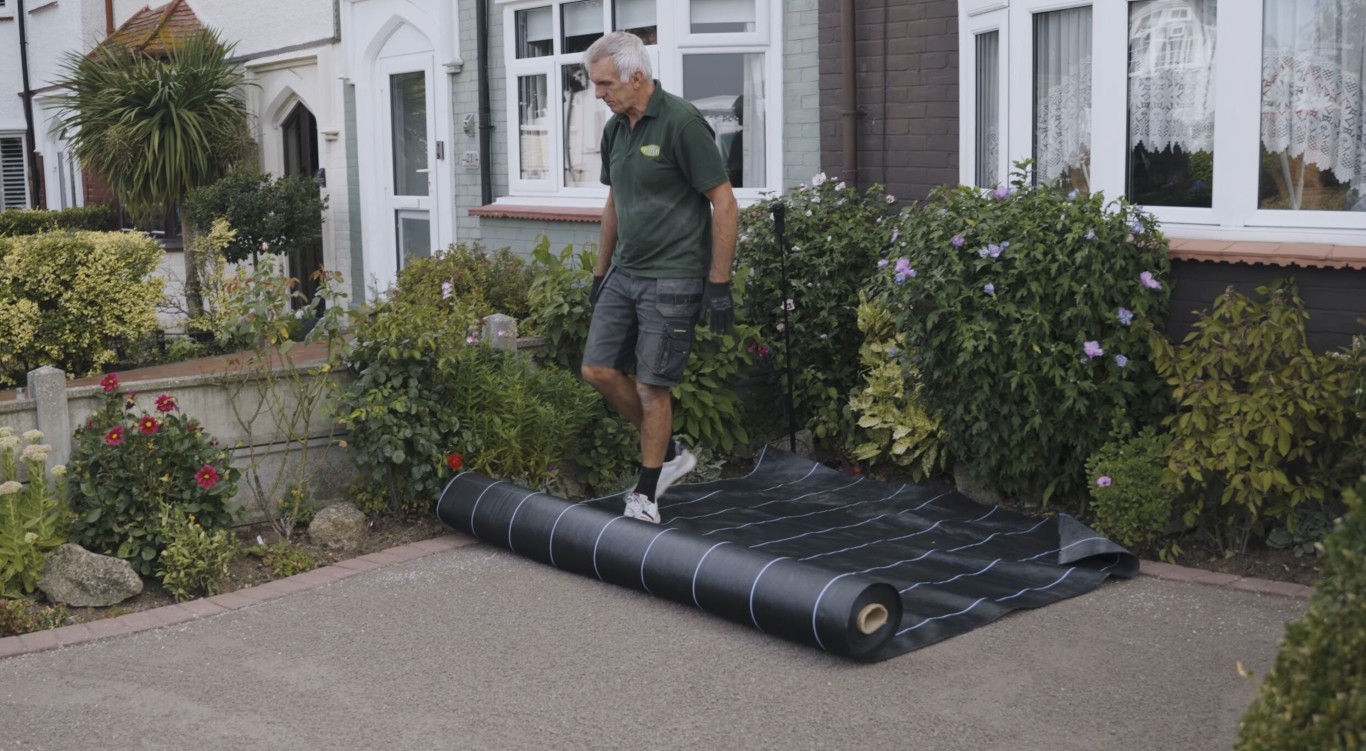 Turf removal and weed barrier installation